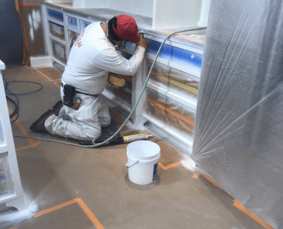 Portland house painter protecting floors with paper and tape