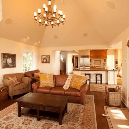 Finished living room with chandelier and furniture