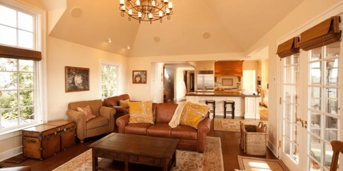 Finished living room with chandelier and furniture