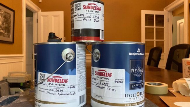 Interiorpaintcans 1 Pile of interior paint cans with Sundeleaf Painting sticker tags