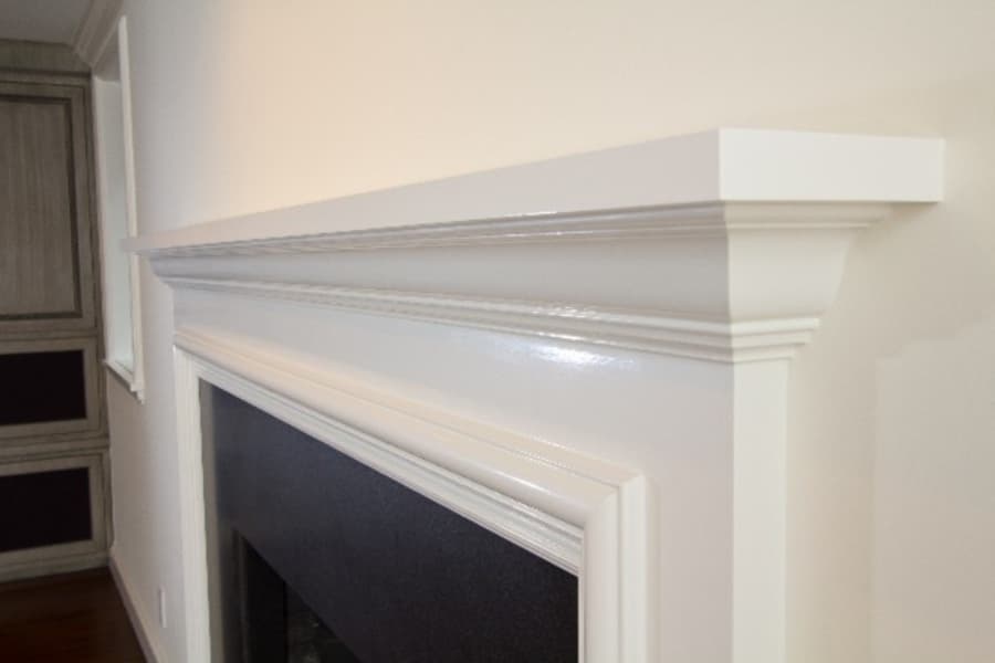 Close Up Shot Of Fireplace With White Trim
