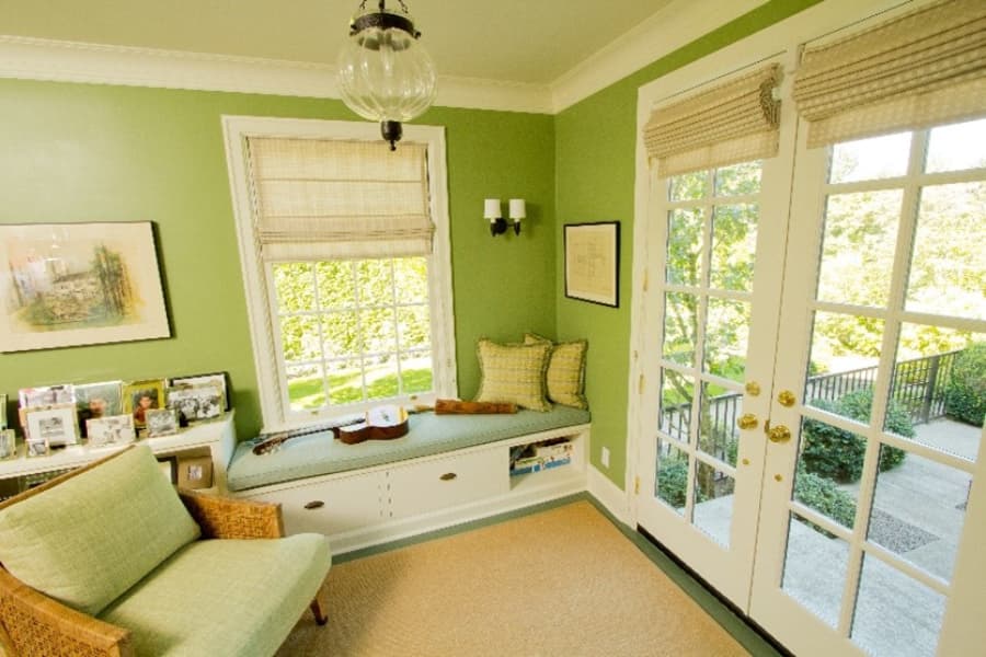 Bright Green Living Room With Window Seat And French Doors