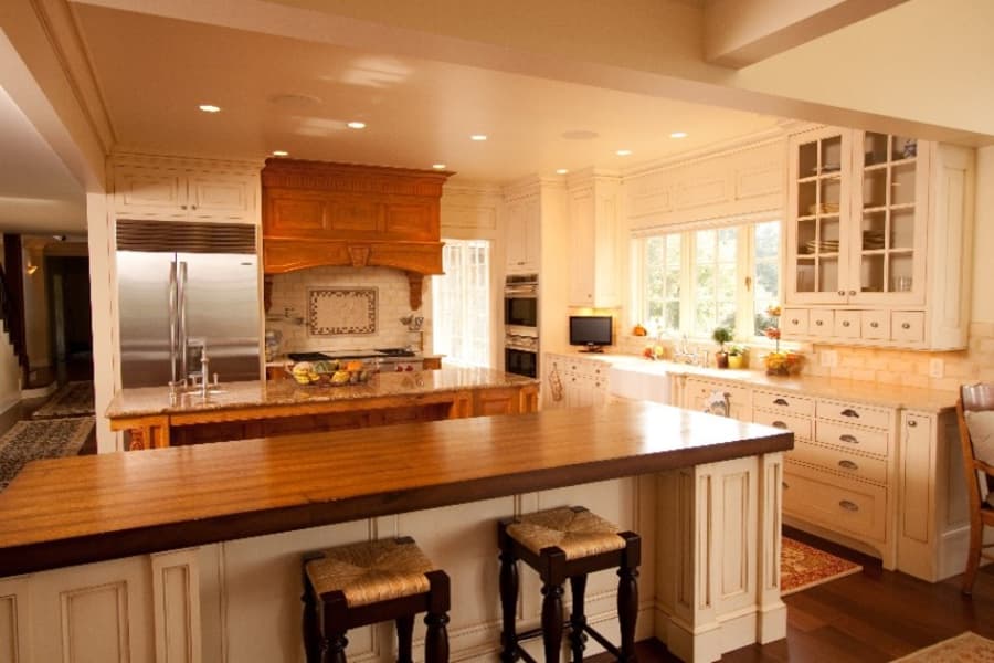 Rustic Kitchen With Island And White Cabinets