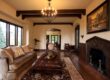 Living room with natural wood beams and furniture