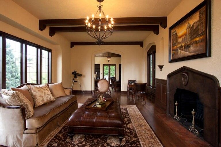 Freshly painted living room with wainscoting and open beams