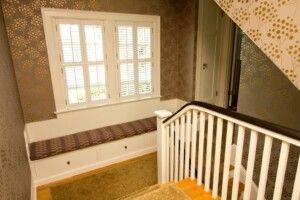 Stairwell with patterned walls-and-window-seat