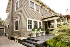 Residential Home With Clean Siding And Stone Porch