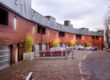 Row Of Townhouses With Clean Asphalt And Siding