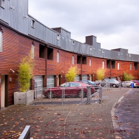 Row Of Townhouses With Clean Asphalt And Siding