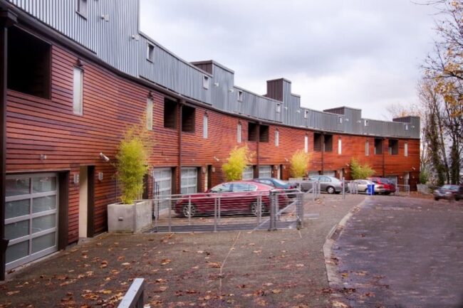 Row Of Townhouses With Clean Asphalt And Siding