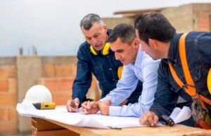 Architect Talking To Contractors On Project Site